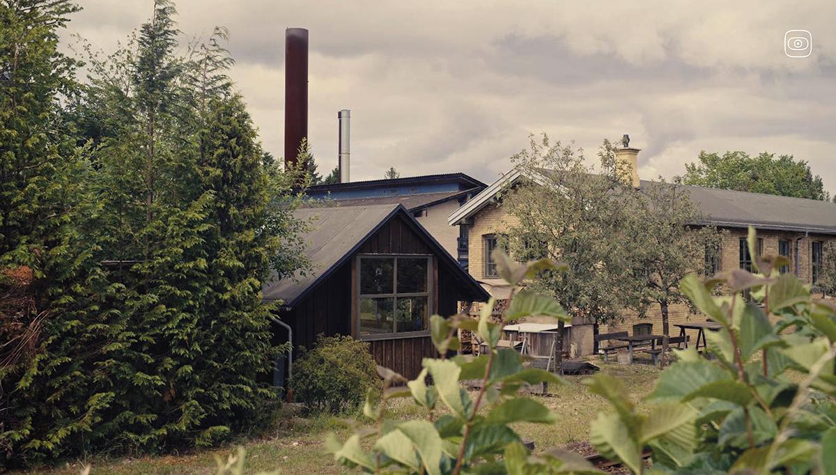 The factory chimney towers over the small town of Kvistgård.
