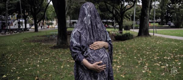 A Venezuelan woman who is 37 weeks pregnant in a park in northern Bogotá.  Photograph by Marina Sardiña.