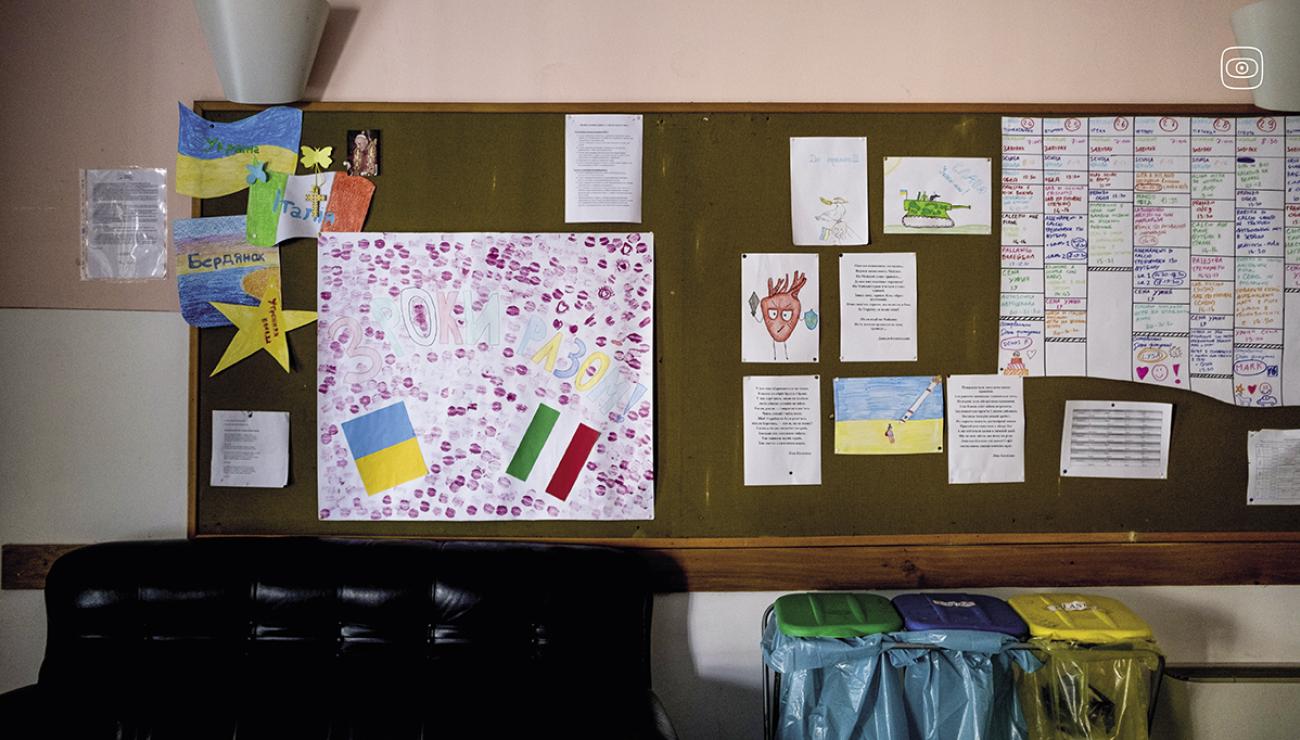 A board with Ukrainian and Italian flags hangs in one of the walls of Stella Mattutina, a reception home in Rota Imagna, Bergamo province, where Ukrainian orphans and their guardians have been living in since May 2022