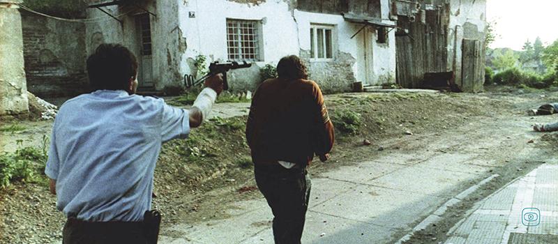 The photo depict the cold-blooded murder of Bosniak civilians by a Serb war criminal, Goran Jelisić. 