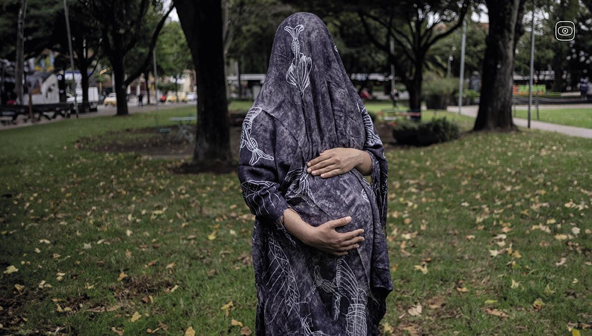  A Venezuelan woman who is 37 weeks pregnant in a park in northern Bogotá.  Photograph by Marina Sardiña.