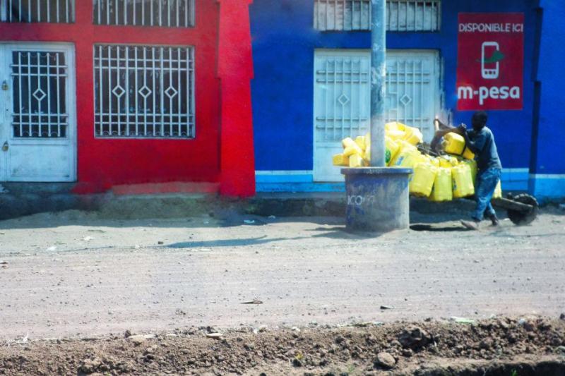 A young milkman on his way to Goma with a load of milk for the Congolese market.