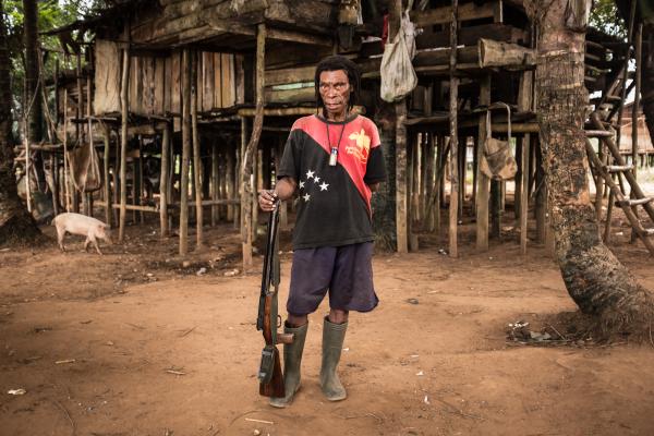 Agustinus Keong, 68, works as a labourer in an oil palm plantation, after his clan’s forest was cleared in early 2014. Photo by Albertus Vembrianto.