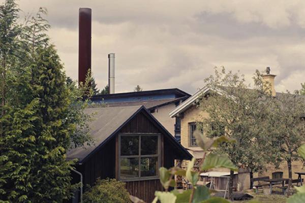 The factory chimney towers over the small town of Kvistgård.