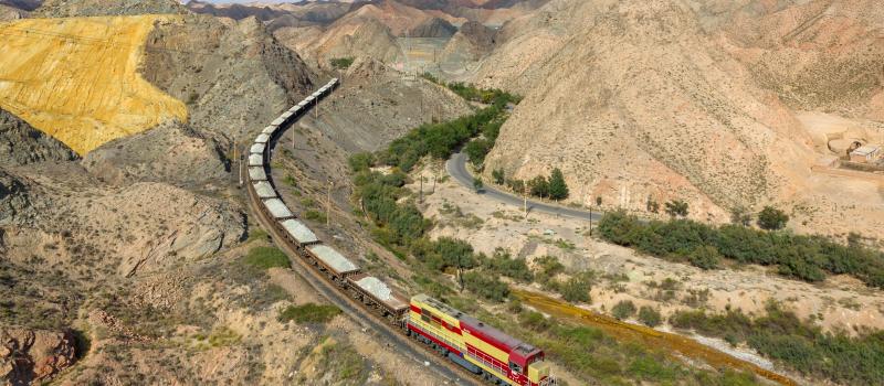 Baiyin Nonferrous Metals Corporation's DF7G 5183 hauls an ore train from the Baiyin zinc mine to the refinery. Pictured north of Baiyin, China.